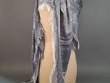 grey and white scarf with fringes on mannequin dummy