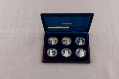 an image of a set of four silver coins in a blue box