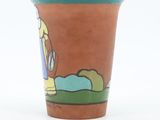 a brown cup with a picture of a man and a dog on it