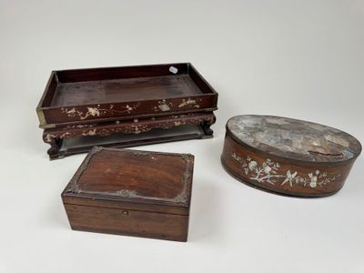 three small wooden boxes are sitting on a white surface