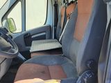 the interior of a van with the door open and the driver ' s seat up