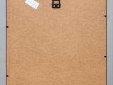 a close up of a cork board with a piece of paper attached to it