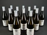several bottles of wine are lined up on a table