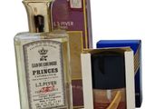 several different types of perfumes and boxes on a white surface