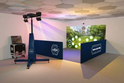 a photo of a room with a large screen and a tv