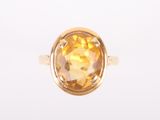 a close up of a ring with a citrine stone in it
