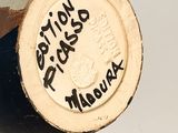 a close up of a brown and white vase with writing on it