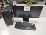 un ordinateur de bureau posé sur une table avec un clavier et une souris
