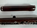 an image of two clarinets sitting side by side on a white surface