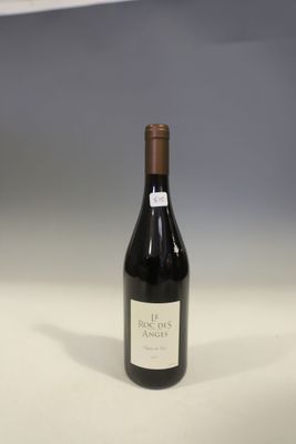 a bottle of wine that is sitting on a table