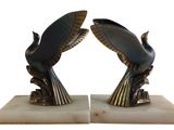 a pair of bookends made of metal and marble