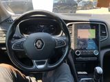 the interior of a car with a steering wheel, dashboard, and a touch screen