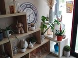 a room with shelves and a clock on the wall