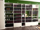 a room with a lot of boxes on the shelves