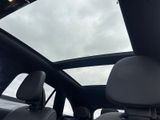 a view of the sunroof from inside of a car