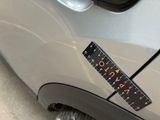 a close up of a sticker on a car ' s bumper