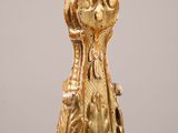 a gold vase with a crown on top of it