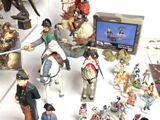 many figurines that are on display on a table