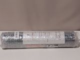 a close up of a roll of silver foil on a white surface