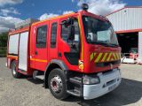 a red fire truck that is parked in front of a building
