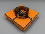 an orange box with a black belt on top of it
