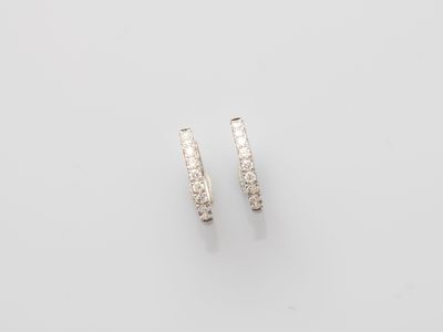 a pair of diamond hoop earrings