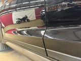 a close up of a car with a motorcycle on the side of it