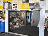 an image of a garage with a lot of items in it