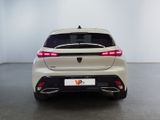 the rear end of a white car in a white room