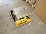 a table saw sitting on the floor in the garage