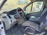 a picture of a car with a seat and a bag in the passenger seat