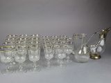 many glasses and a pitcher sitting on a table