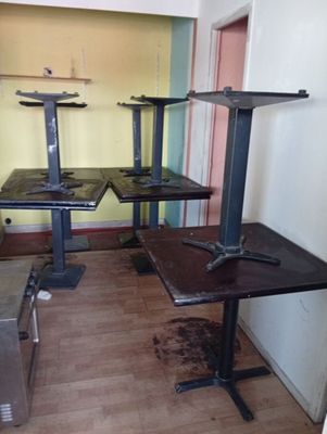 three tables and two benches in a room