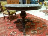 a table that has a marble top on it