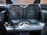 a picture of the back seat of a car with a cell phone in it
