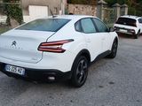 a white car parked on the side of the road