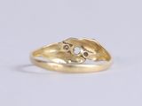 an image of a gold ring with a diamond