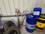 a blue barrel and a pair of scissors sitting next to a blue barrel
