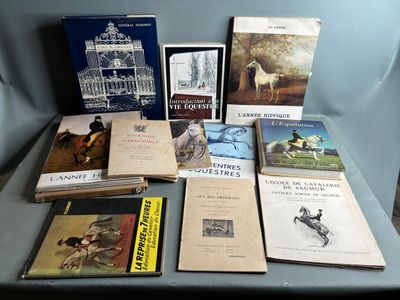 several books are sitting on a blue chair in front of a blue chair