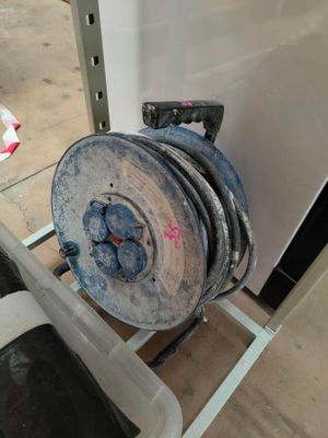 a picture of a reel on a cart in a room