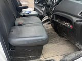 a white van with black seats in the back of it