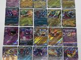 a bunch of pokemon cards sitting on top of a table