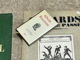 two books that are laying on the ground next to each other