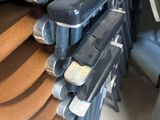 a lot of chairs that are stacked on top of each other