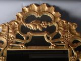a mirror that is sitting on the wall in the room