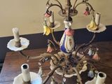 a chandelier that is sitting on a wooden table