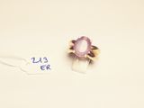 a ring with a purple stone on it and a price tag