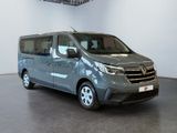 the grey van is parked in a large room with a ceiling fan