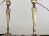 two lamps that are sitting on a table next to each other