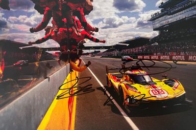 signed autographed photograph of a yellow race car and a yellow race car